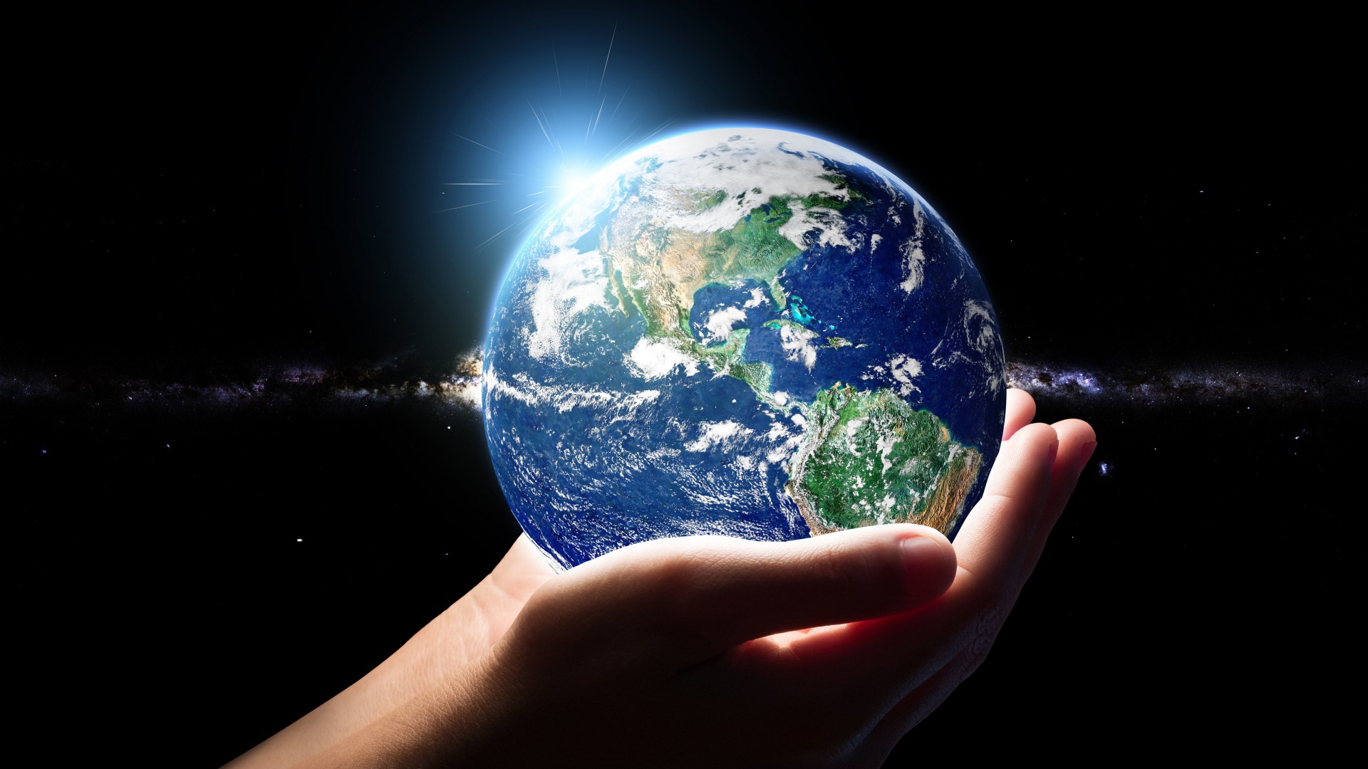 imagem do planeta terra em cima de uma mão, mostrando como ter a vida dos sonhos